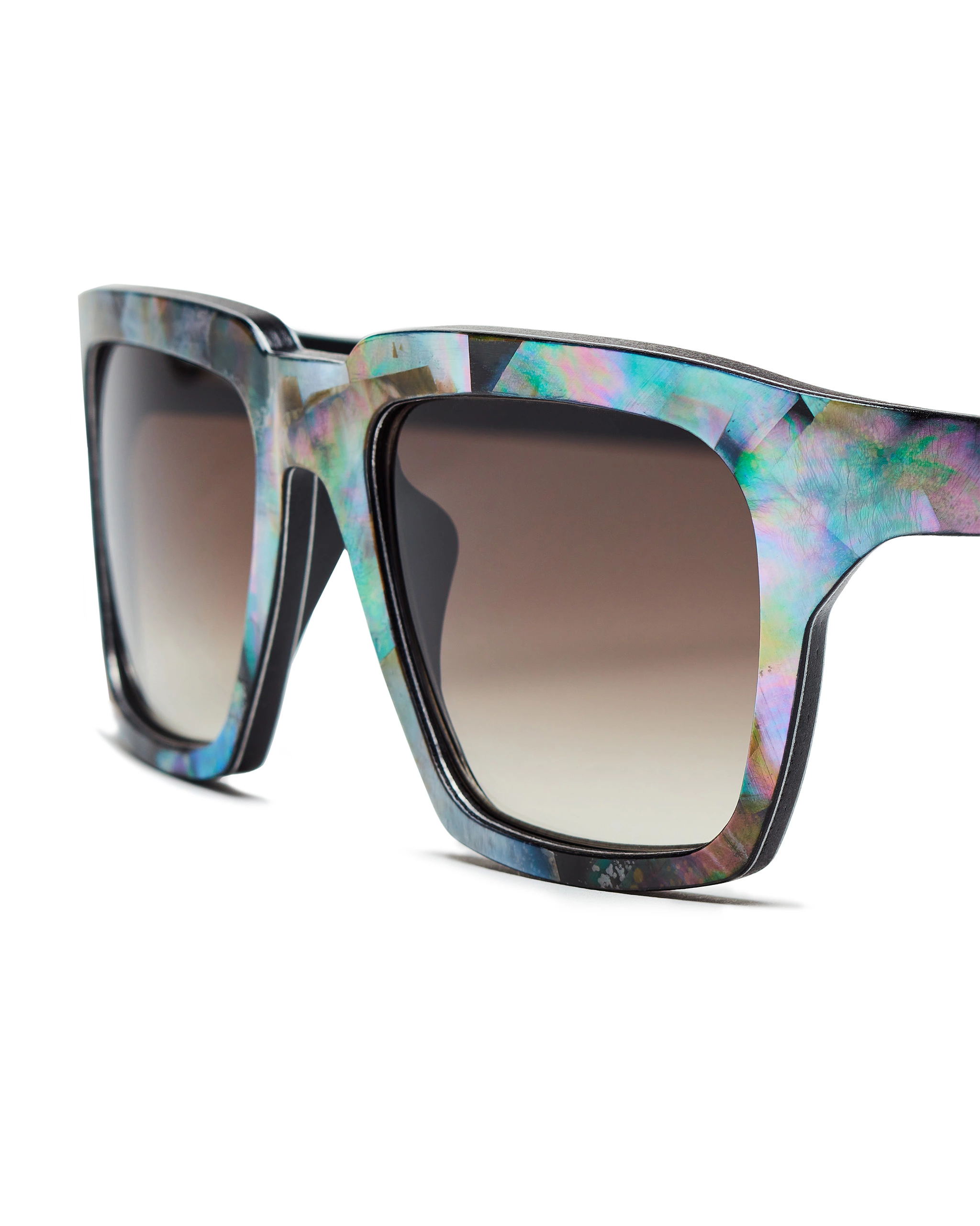 a pair of mother of pearl sunglasses with a floral pattern