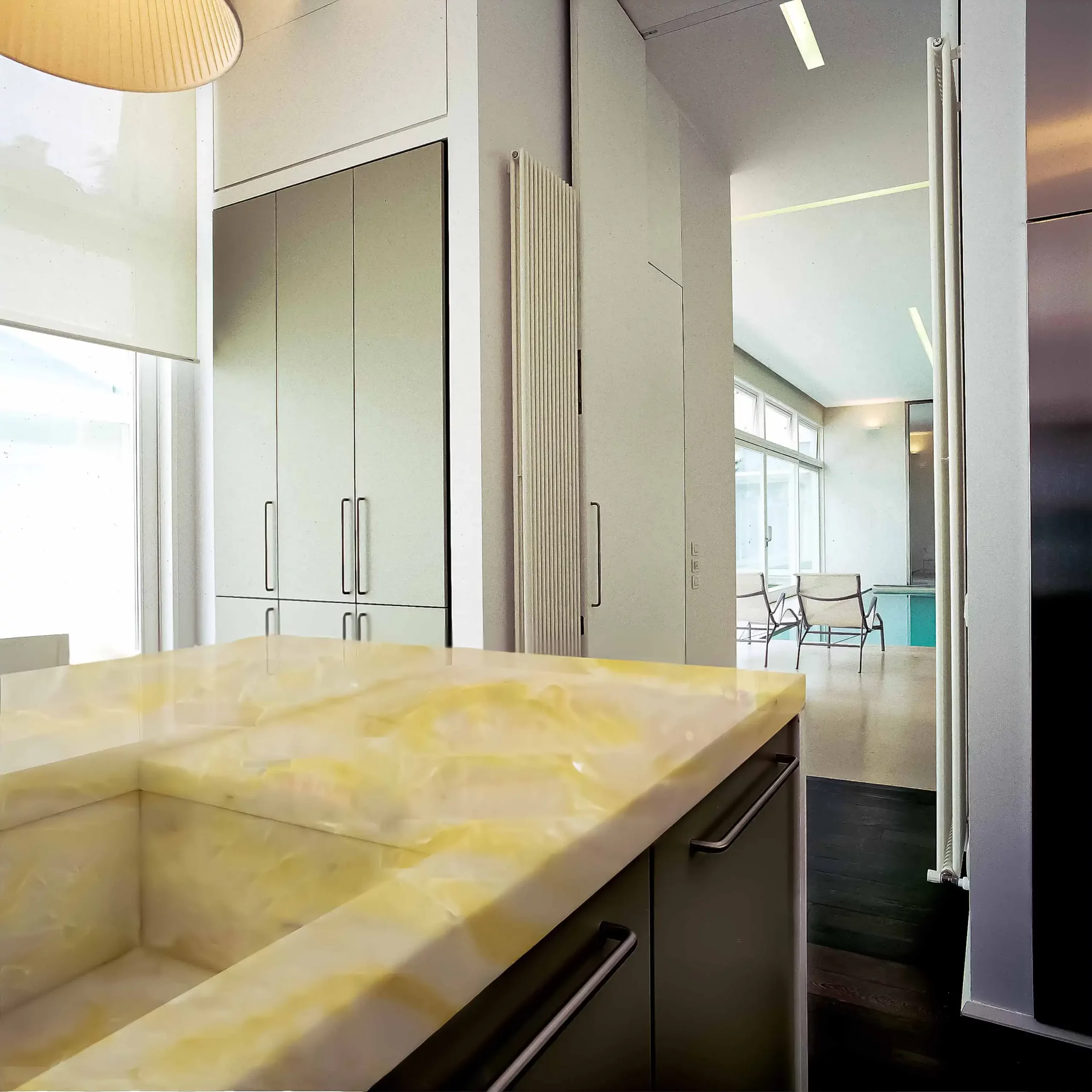 a kitchen with a mother of pearl marble countertop