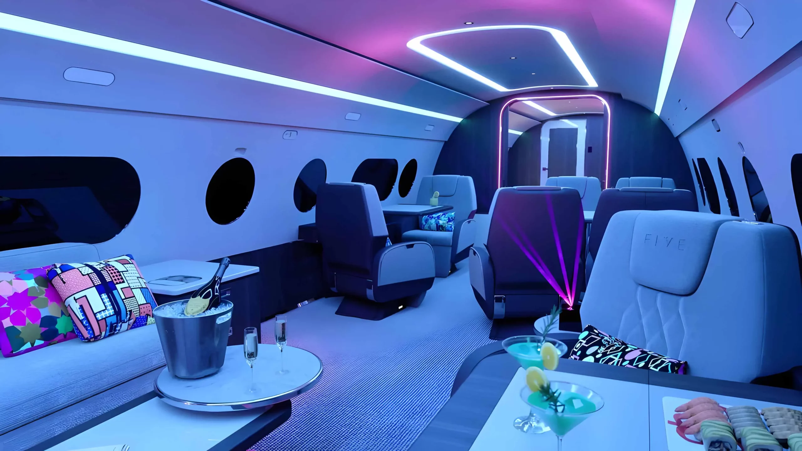 a inside of a plane with drinks and tables Aviation private jet