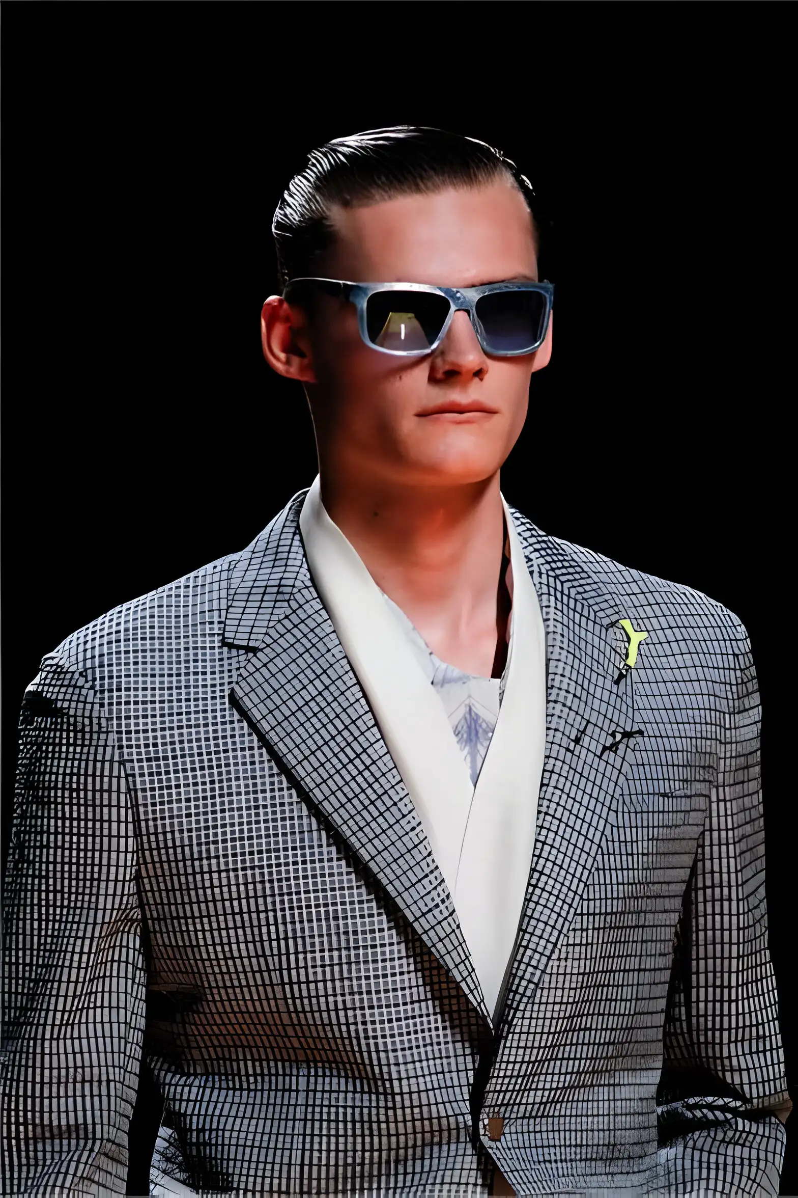 a person in a suit and sunglasses model