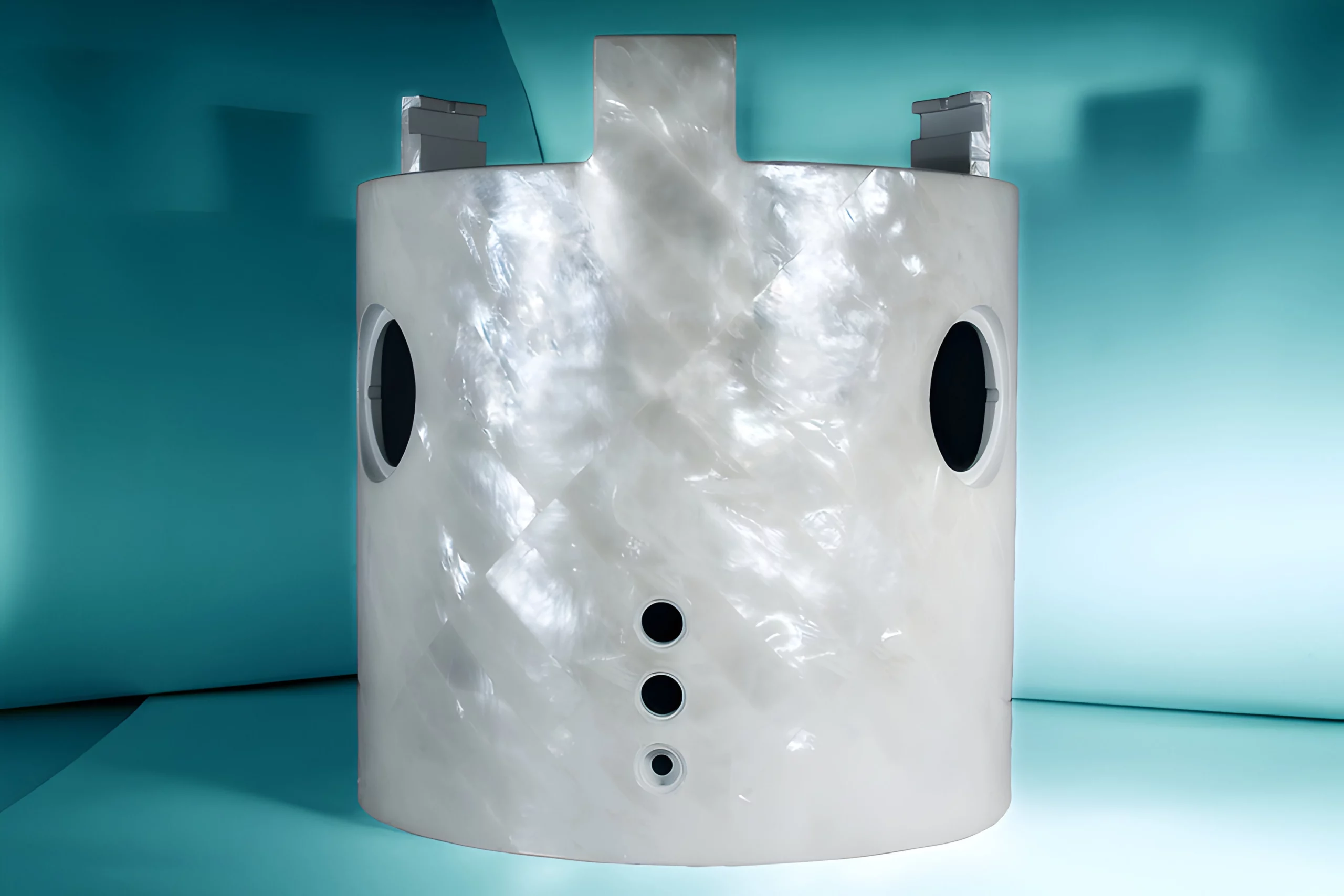 a white cylinder with holes