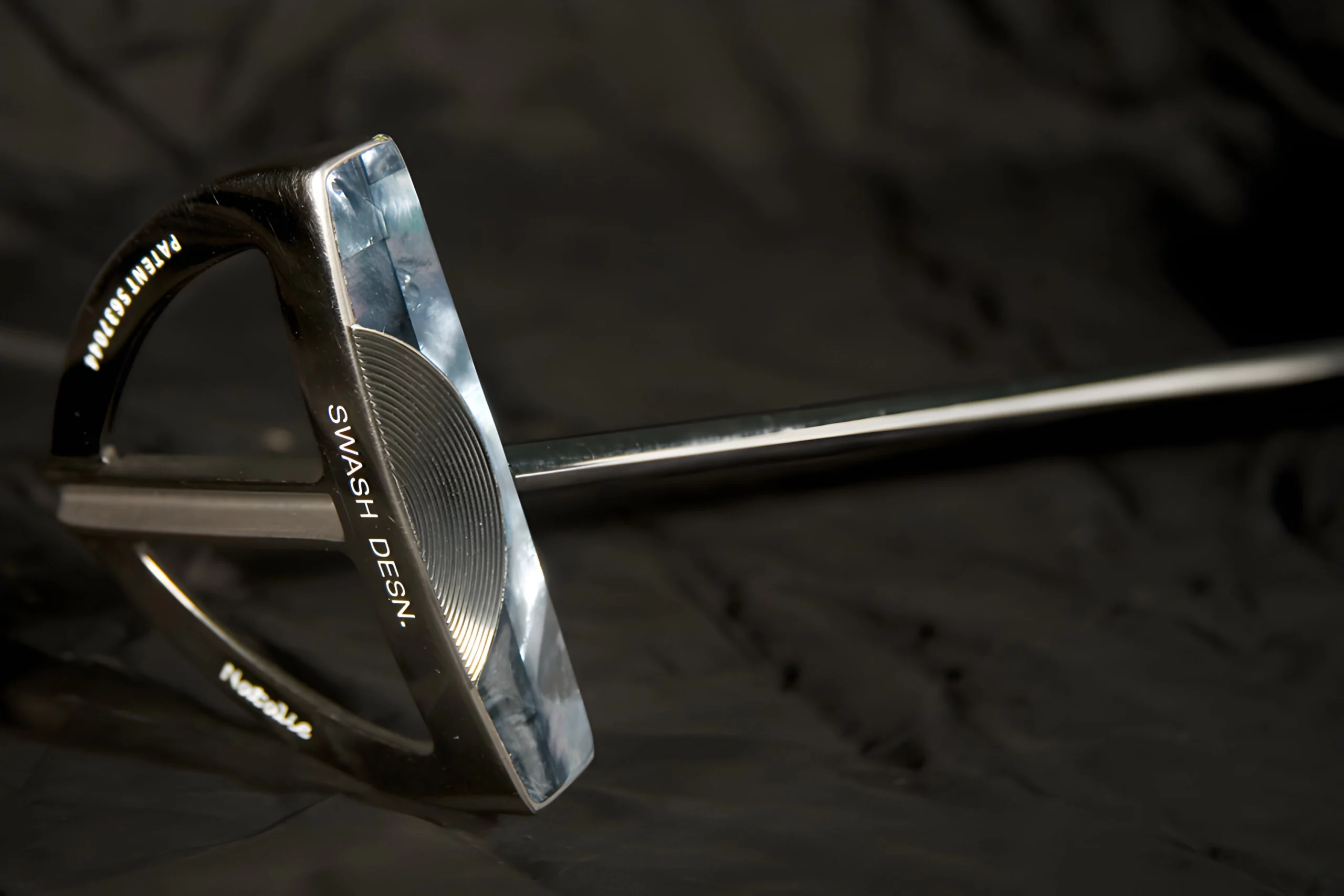 a close up of a golf club mother of pearl